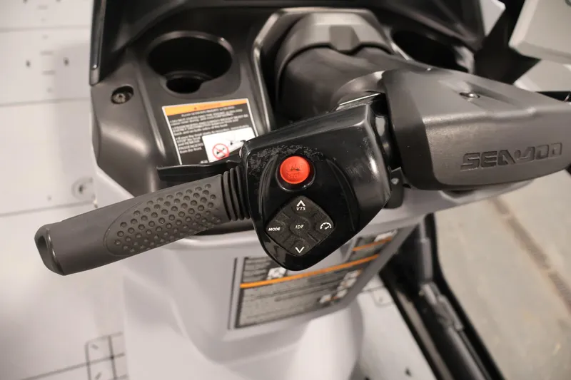 Slide: The Image of Close-up of 2025 Sea-Doo Switch Fish 21 handlebar controls and grip. - 20