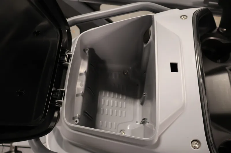 Slide: The Image of Open storage compartment of 2025 Sea-Doo Switch Fish 21 watercraft. - 21