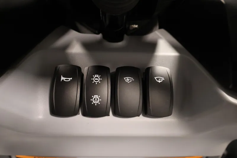 Slide: The Image of Control panel of 2025 Sea-Doo Switch Fish 21 with four black switches. - 26