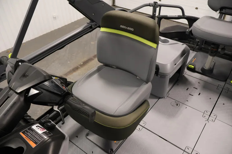 Slide: The Image of 2025 Sea-Doo Switch Fish 21 interior with gray seating and control panel. - 27