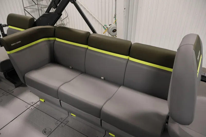 Slide: The Image of 2025 Sea-Doo Switch Fish 21 interior seating with gray and green accents. - 29