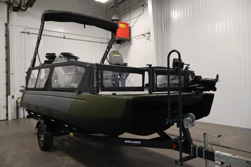 Slide: The Image of 2025 Sea-Doo Switch Fish 21 boat on trailer in indoor setting. - 3