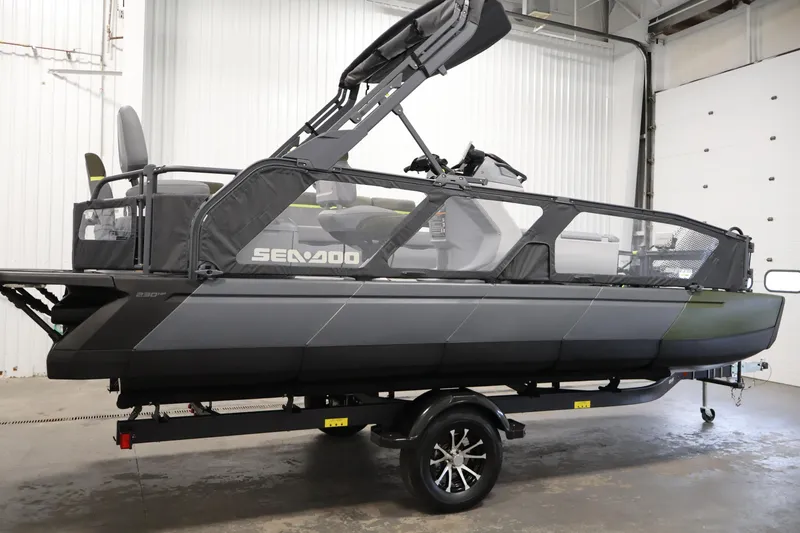 Slide: The Image of 2025 Sea-Doo Switch Fish 21 pontoon boat in a garage setting. - 4