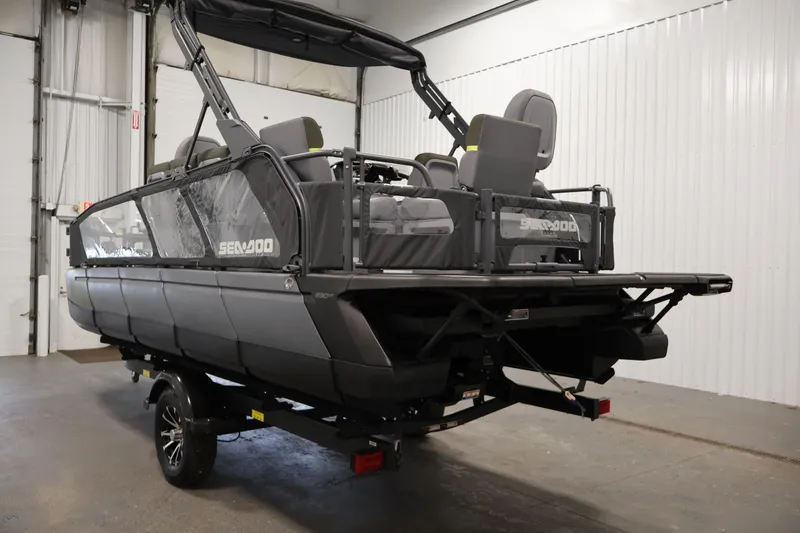 Slide: The Image of 2025 Sea-Doo Switch Fish 21 pontoon boat in warehouse. - 7