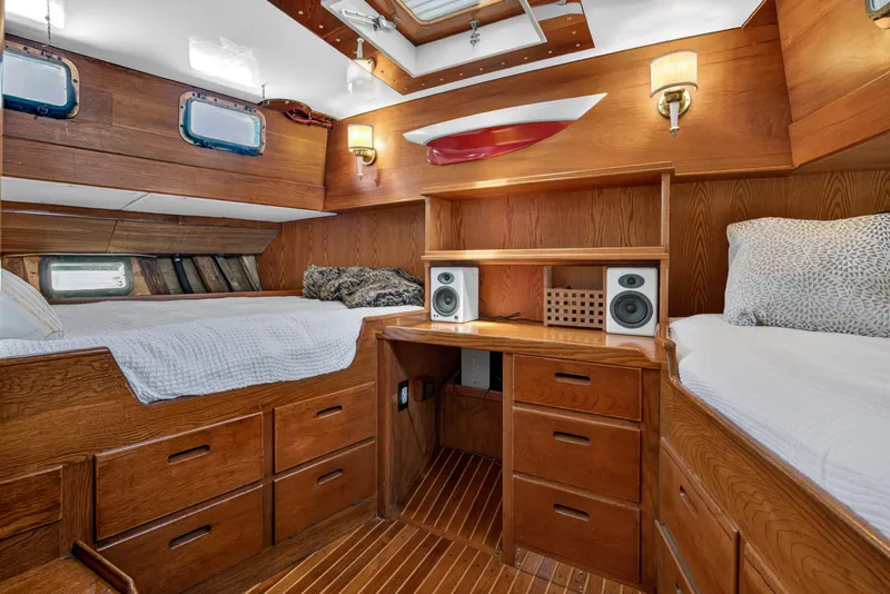 Slide: The Image of 1961 Vic Franck Custom yacht interior with wooden cabinetry, twin beds, and built-in speakers. - 10