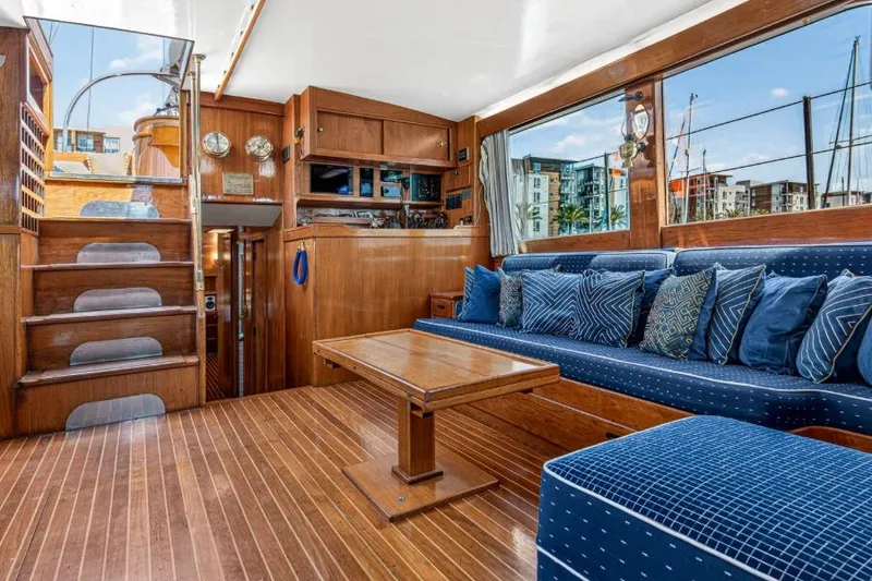 Slide: The Image of Luxurious 1961 Vic Franck Custom yacht interior with wooden decor and blue seating. - 17