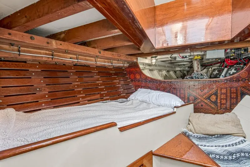Slide: The Image of Cozy wooden cabin interior of 1961 Vic Franck Custom boat with bed and decorative elements. - 24