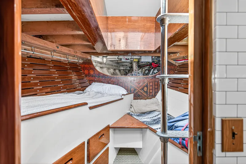 Slide: The Image of Interior of 1961 Vic Franck Custom boat with wooden bunk beds and nautical decor. - 7