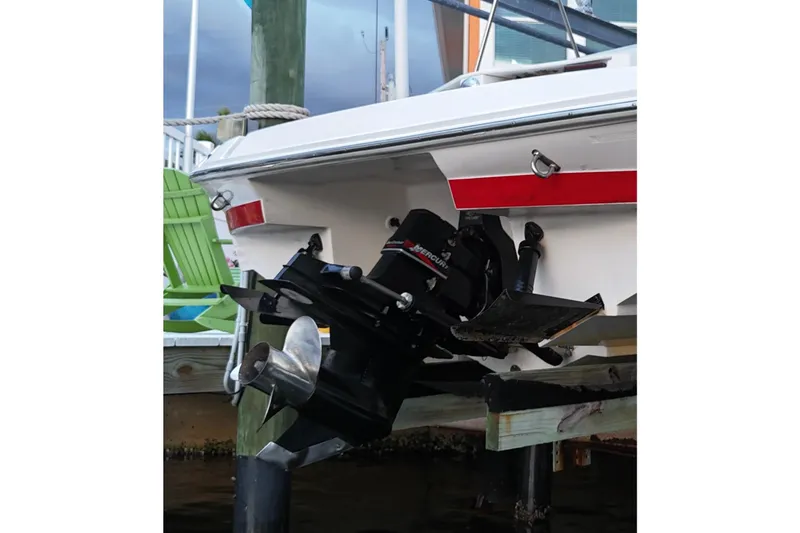 Slide: The Image of 2004 Regal 2000 Bowrider boat with Mercury outboard motor at dockside. - 19