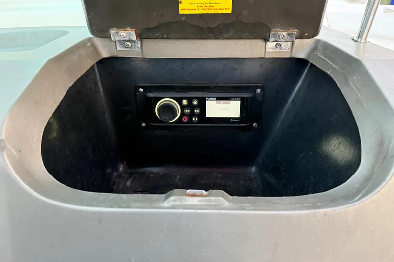 Slide: The Image of 2004 Regal 2000 Bowrider boat stereo compartment with Fusion MS-RA70 radio. - 22