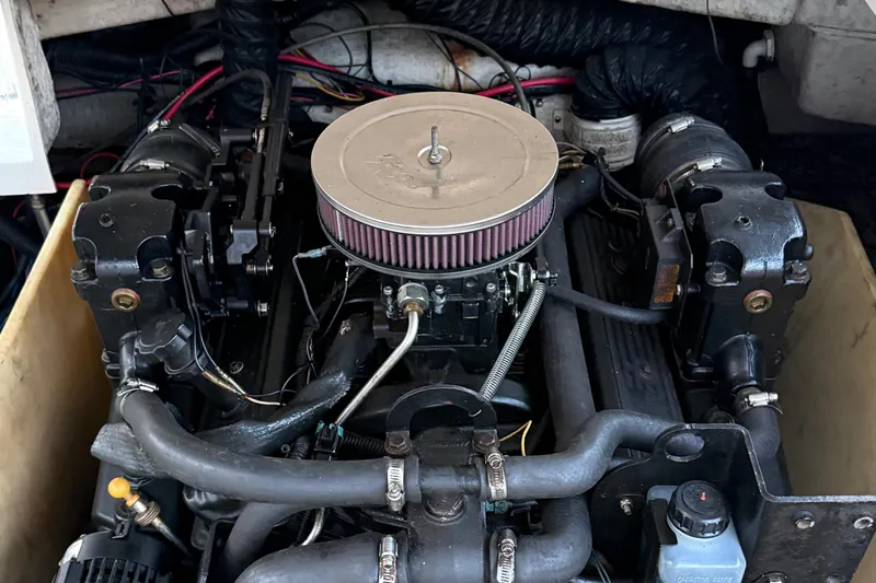 Slide: The Image of Engine of a 2004 Regal 2000 Bowrider boat, showcasing mechanical components and wiring. - 29