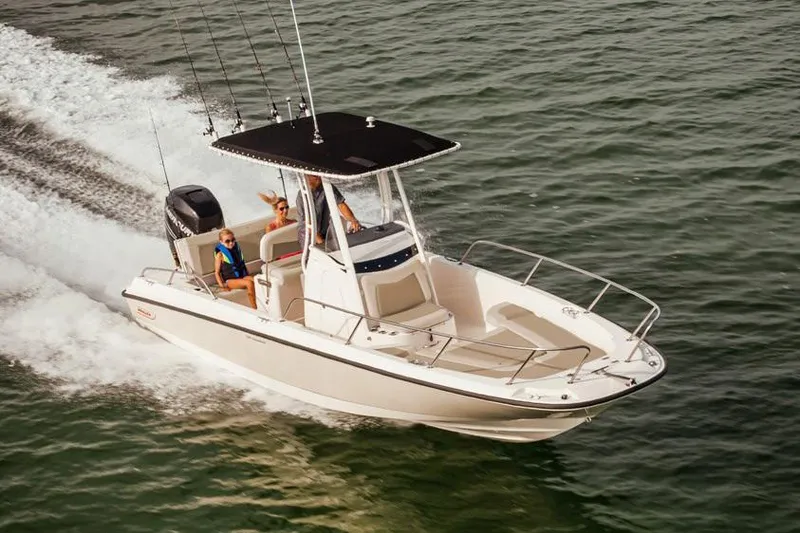 Slide: The Image of Manufacturer Provided Image: 2020 Boston Whaler 240 Dauntless boat cruising on water with passengers. - 5