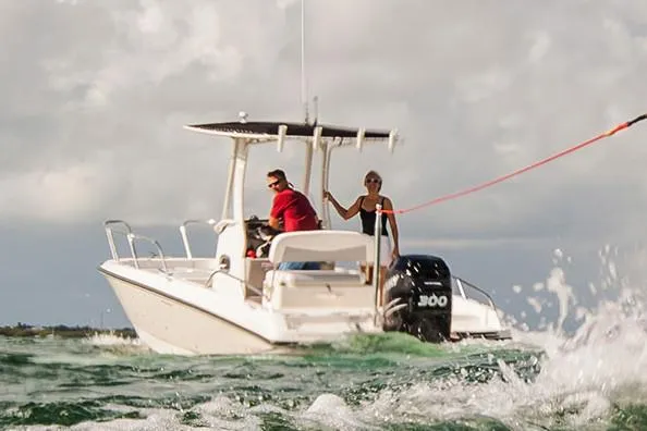 Slide: The Image of Manufacturer Provided Image: 2020 Boston Whaler 240 Dauntless boat on water with two people. - 6