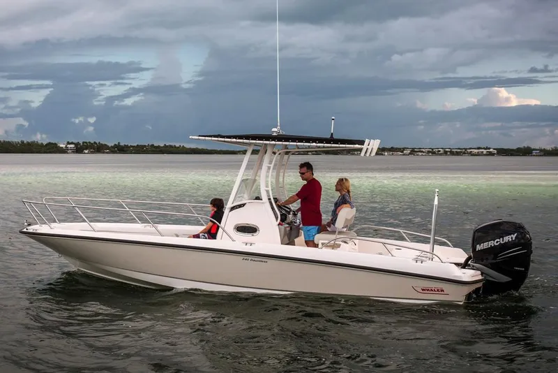 Slide: The Image of Manufacturer Provided Image: 2020 Boston Whaler 240 Dauntless boat cruising on calm waters with passengers. - 8