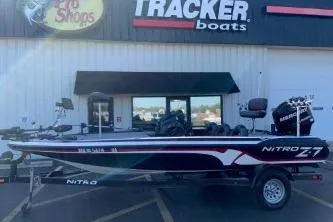 The Image of 2010 Nitro Z-7 boat on trailer outside Tracker Boats store. - 1
