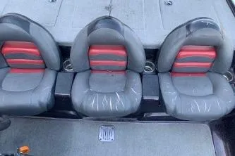 Slide: The Image of Three gray and red seats in a 2010 Nitro Z-7 boat interior. - 10