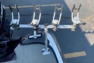 Slide: The Image of Fishing rod holders on a 2010 Nitro Z-7 boat, parked in a lot. - 11