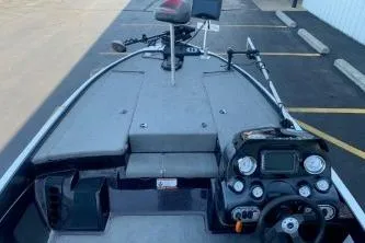 Slide: The Image of 2010 Nitro Z-7 boat interior with steering console and fishing equipment. - 12