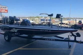 Slide: The Image of 2010 Nitro Z-7 fishing boat on trailer in parking lot. - 2