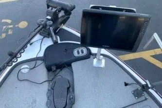 Slide: The Image of 2010 Nitro Z-7 boat dashboard with mounted electronics and steering controls. - 5