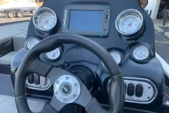 Slide: The Image of Steering console of a 2010 Nitro Z-7 boat with gauges and a navigation screen. - 6