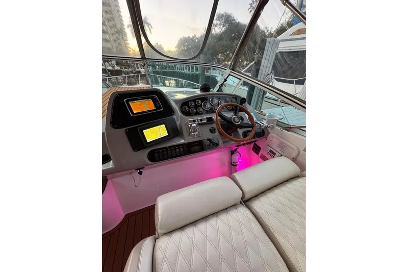 Slide: The Image of Cockpit of 2002 Cruisers Yachts 3575 Express with illuminated controls and leather seating. - 10