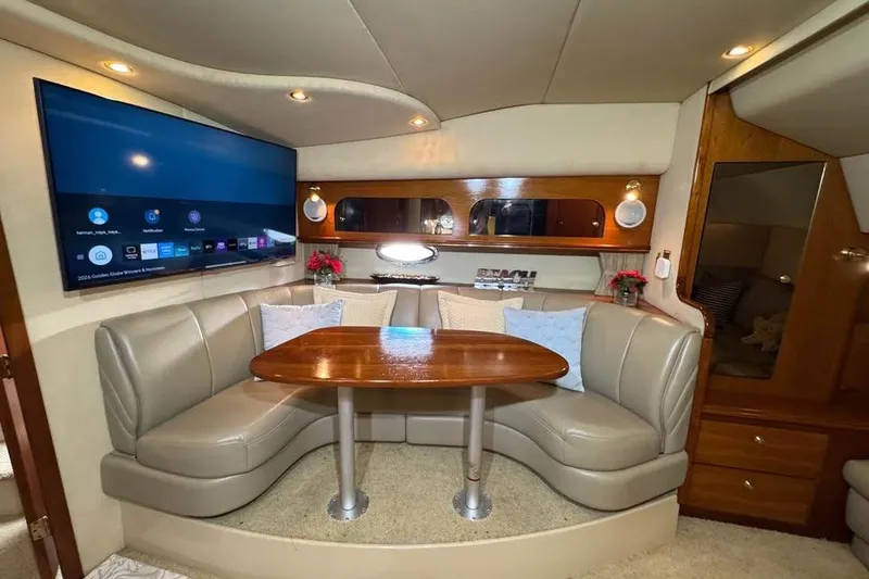 Slide: The Image of Luxurious interior of 2002 Cruisers Yachts 3575 Express with plush seating and modern amenities. - 17