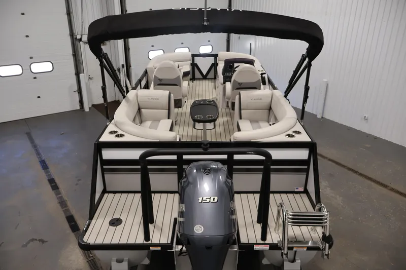 Slide: The Image of 2021 Viaggio Diamante U pontoon boat with Yamaha 150 engine in a garage setting. - 10