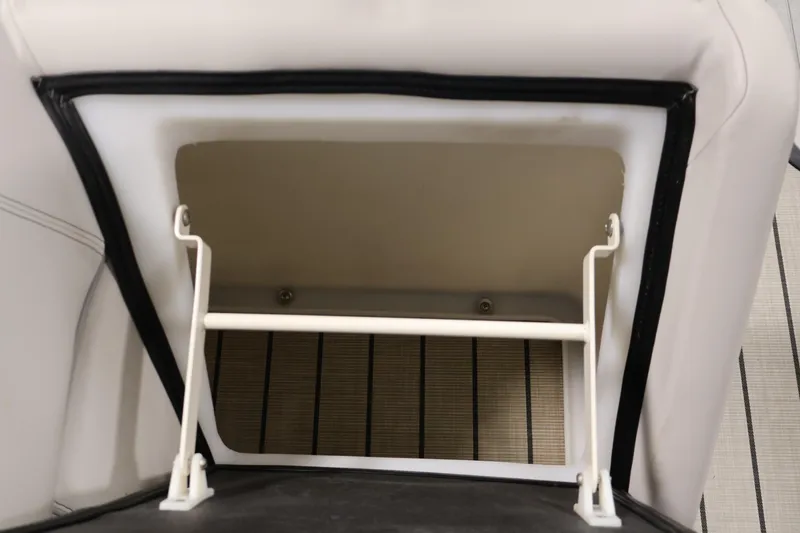 Slide: The Image of Open storage compartment in 2021 Viaggio Diamante U boat, featuring white interior and secure latch. - 31