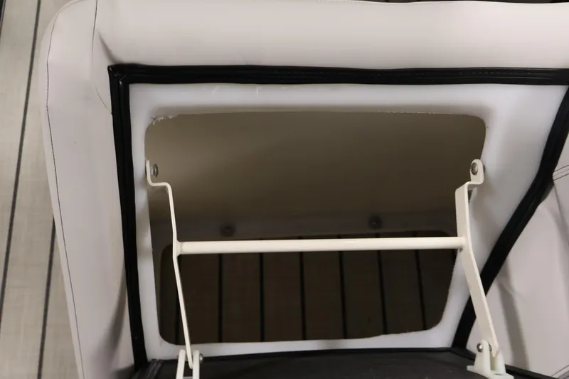 Slide: The Image of Viaggio Diamante U 2021 seat storage compartment with white upholstery and black trim. - 34