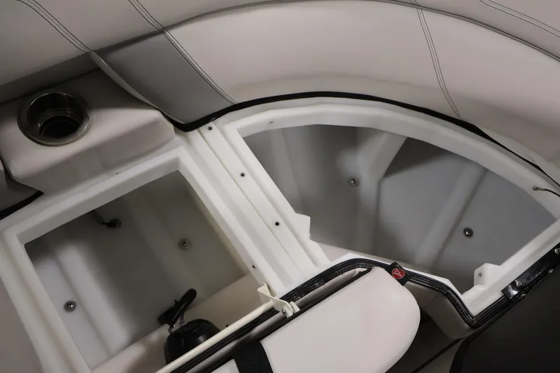 Slide: The Image of Interior storage compartments of a 2021 Viaggio Diamante U boat, featuring sleek design and cup holder. - 35
