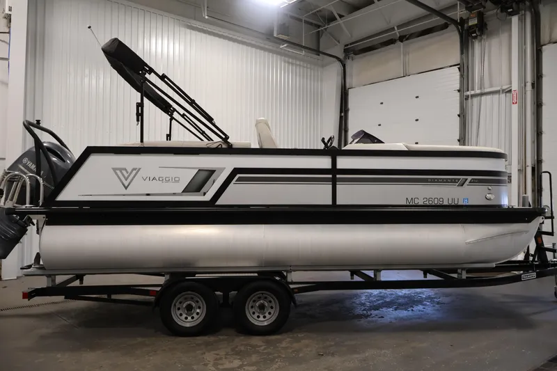 Slide: The Image of 2021 Viaggio Diamante U pontoon boat on trailer in indoor storage. - 4
