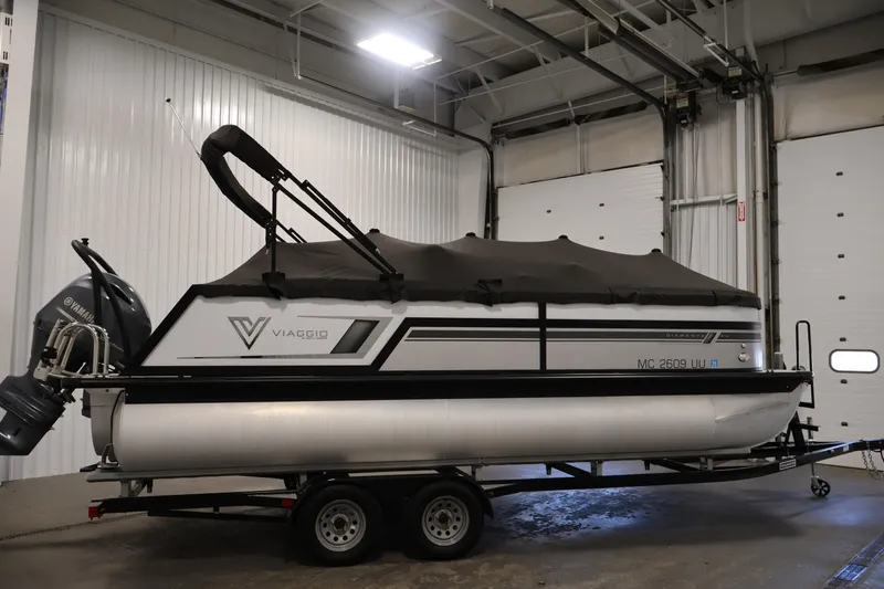 Slide: The Image of 2021 Viaggio Diamante U pontoon boat with Yamaha motor in indoor storage. - 47