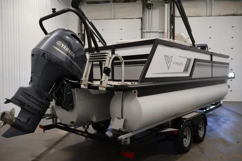 Slide: The Image of 2021 Viaggio Diamante U pontoon boat with Yamaha outboard motor in a garage. - 5