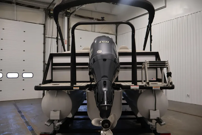 Slide: The Image of 2021 Viaggio Diamante U pontoon boat with 150 HP engine in a garage. - 6
