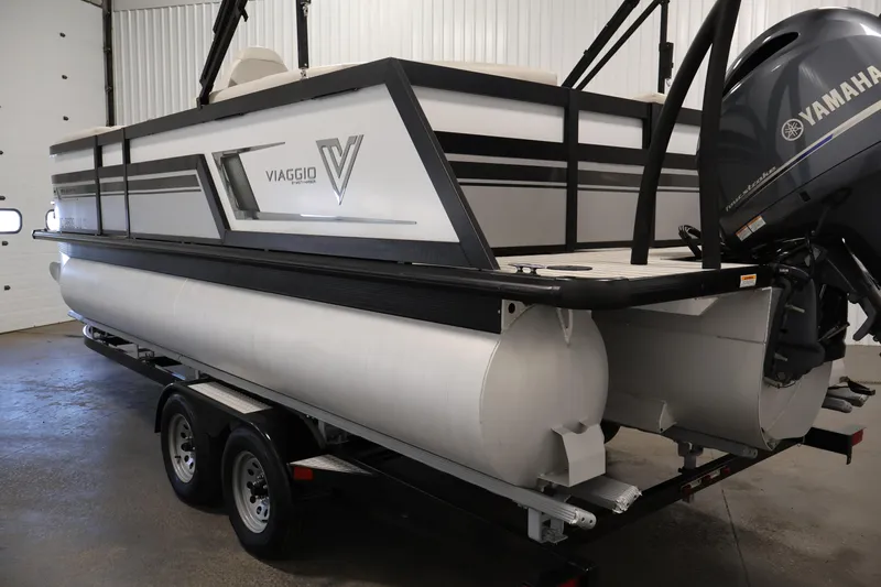 Slide: The Image of 2021 Viaggio Diamante U pontoon boat with Yamaha motor in a garage setting. - 7