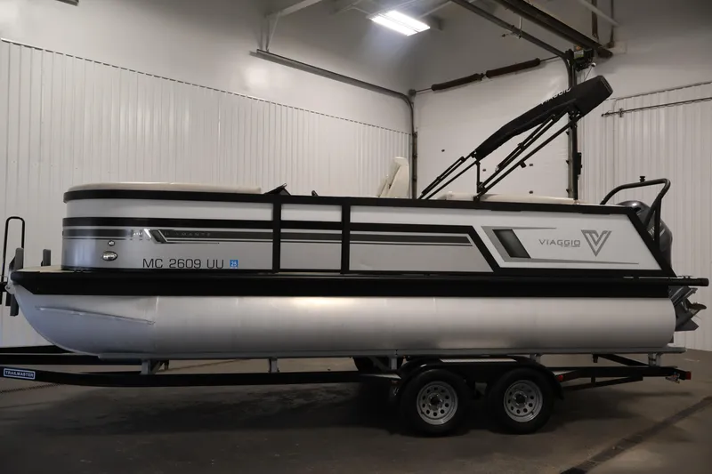Slide: The Image of 2021 Viaggio Diamante U pontoon boat on trailer in indoor storage. - 8