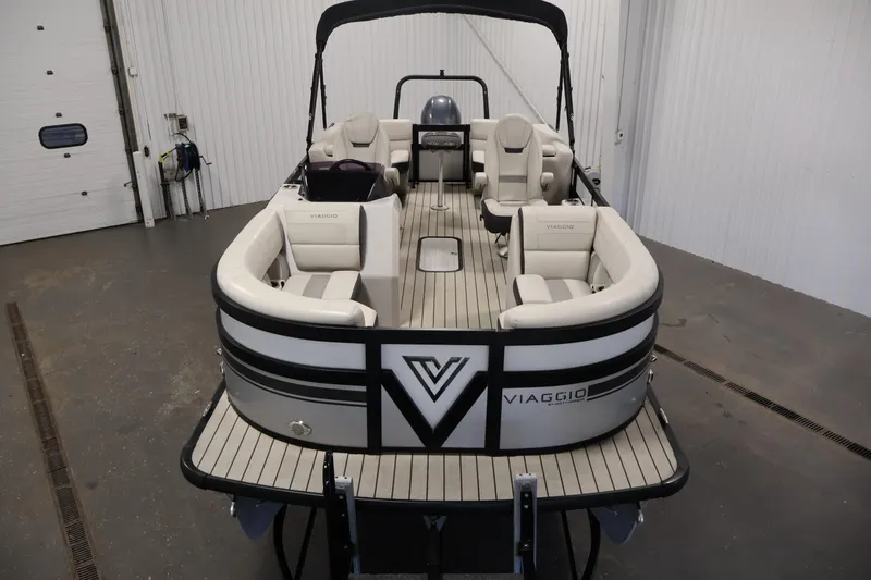 Slide: The Image of 2021 Viaggio Diamante U pontoon boat with elegant seating in a spacious indoor setting. - 9