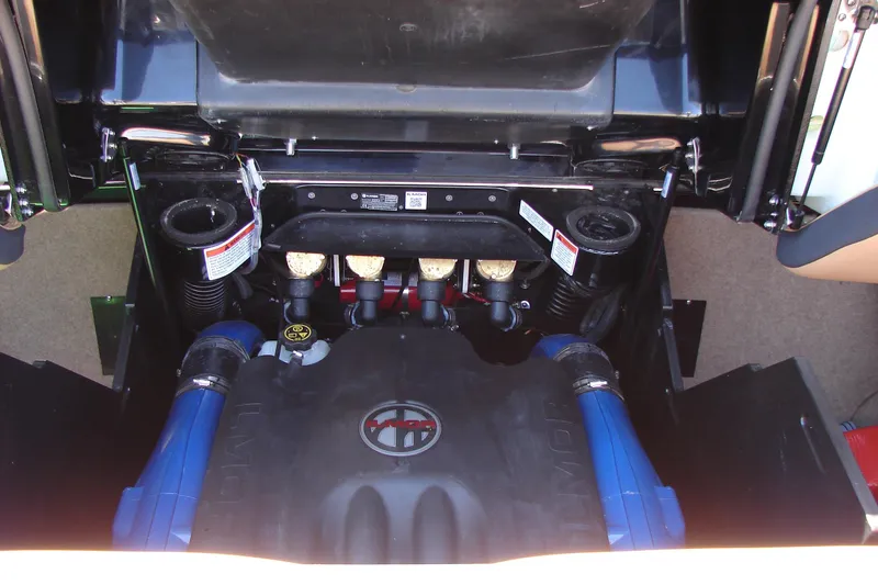 Slide: The Image of Engine compartment of a 2021 MasterCraft X26 boat, showcasing detailed components and layout. - 27