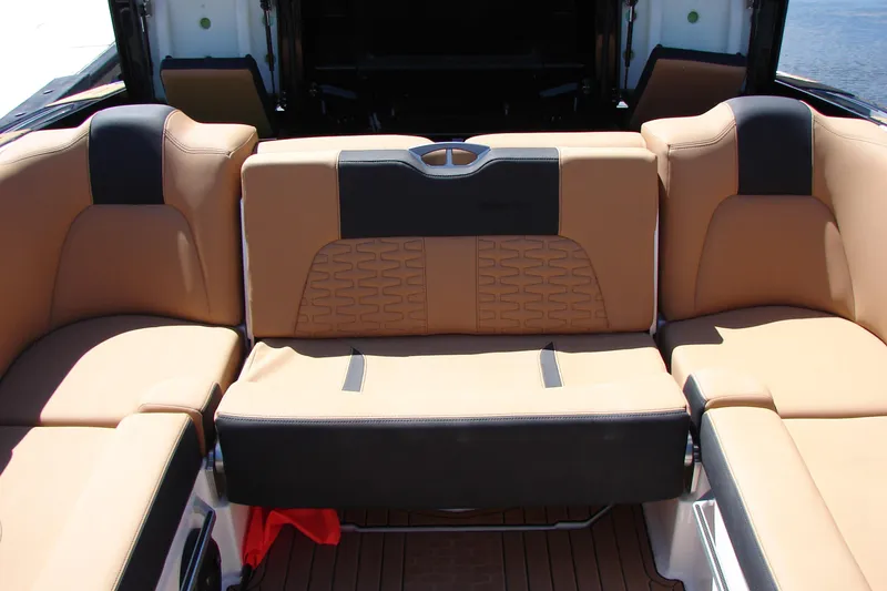 Slide: The Image of Luxurious seating on 2021 MasterCraft X26 boat, featuring tan and black upholstery. - 30