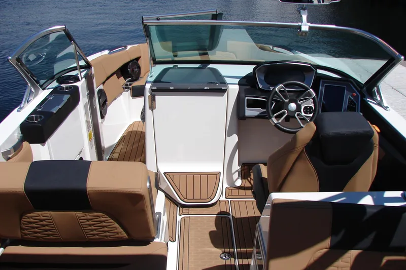 Slide: The Image of Interior of a 2021 MasterCraft X26 boat with luxurious seating and modern dashboard. - 31