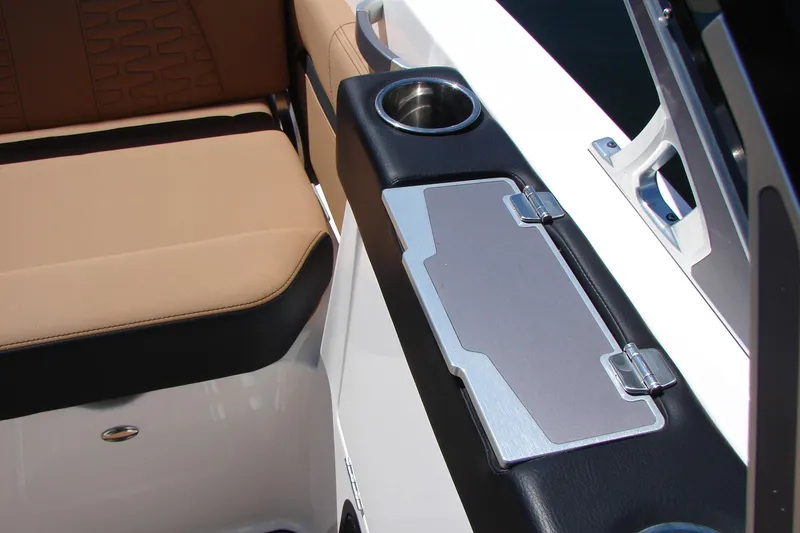 Slide: The Image of Interior of 2021 MasterCraft X26 boat with tan seating and cup holder. - 9