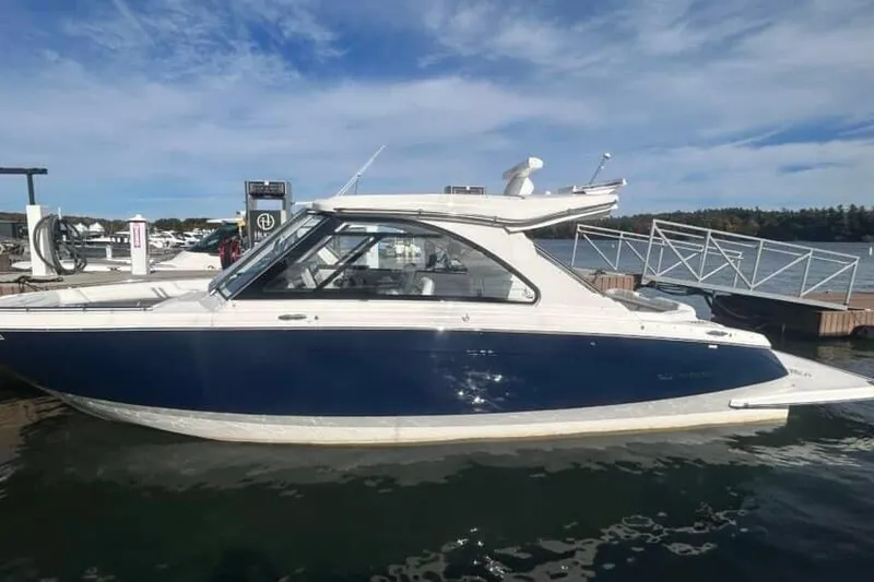 Slide: The Image of 2025 Regal LS36 boat docked on a sunny day, showcasing sleek design and modern features. - 10