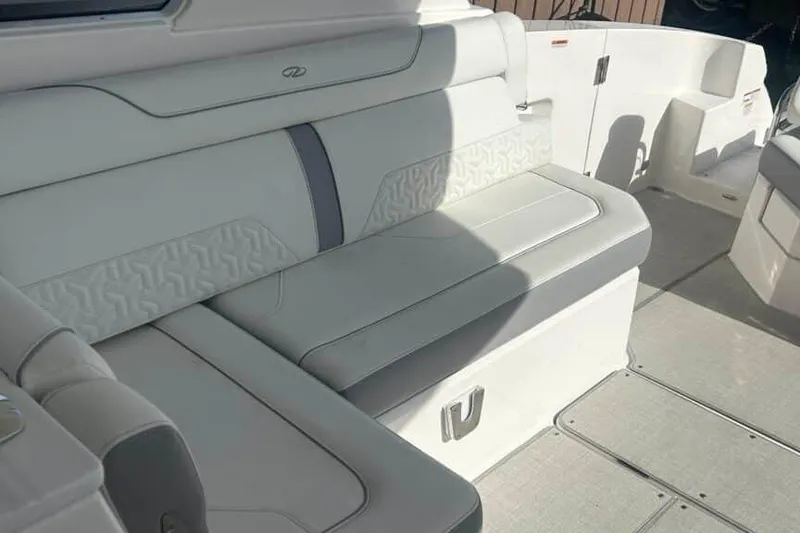 Slide: The Image of 2025 Regal LS36 boat interior with white cushioned seating and elegant design. - 20