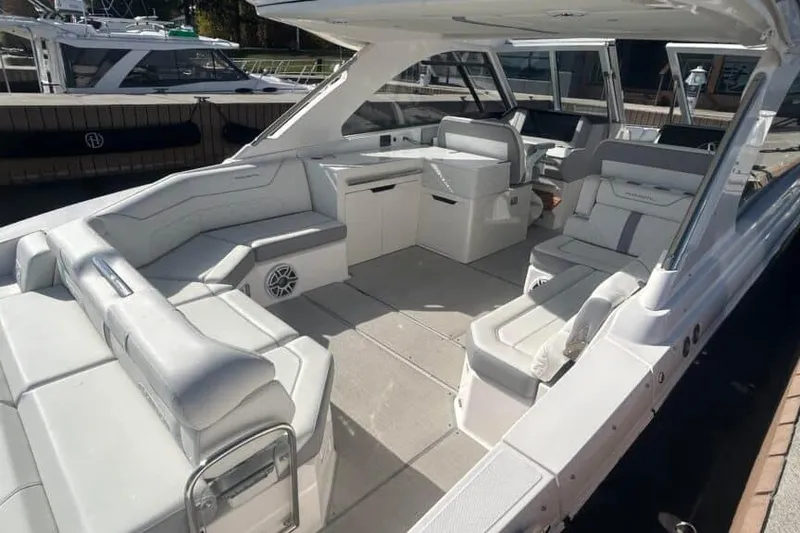 Slide: The Image of 2025 Regal LS36 boat interior with luxurious seating and modern design. - 21