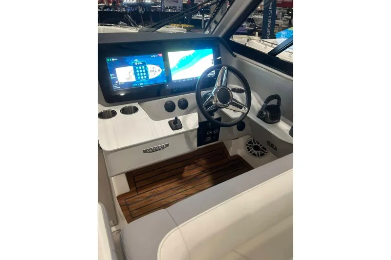 Slide: The Image of 2025 Regal LS36 boat cockpit with modern dashboard and steering wheel. - 4