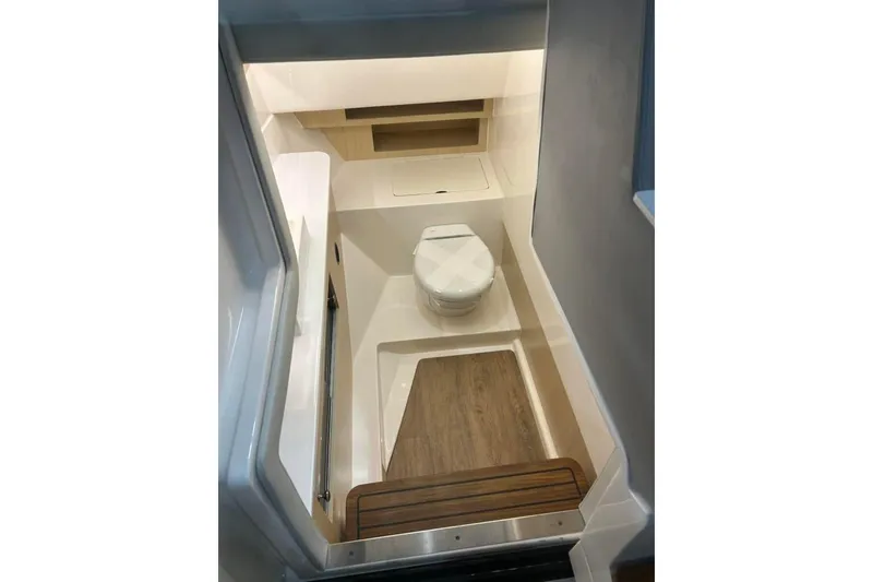 Slide: The Image of 2025 Regal LS36 boat interior bathroom with modern design and wooden flooring. - 5