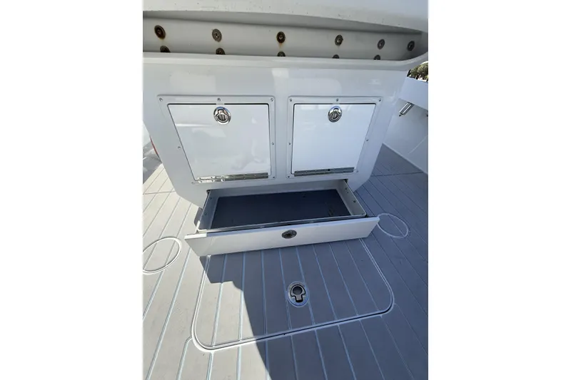 Slide: The Image of Storage compartments on a 2016 Conch 27 boat, featuring sleek design and functionality. - 15