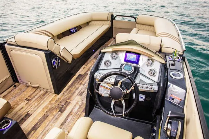 Slide: The Image of Manufacturer Provided Image: 2020 Crest Savannah 250 SLRC boat interior with luxurious seating and modern dashboard. - 17