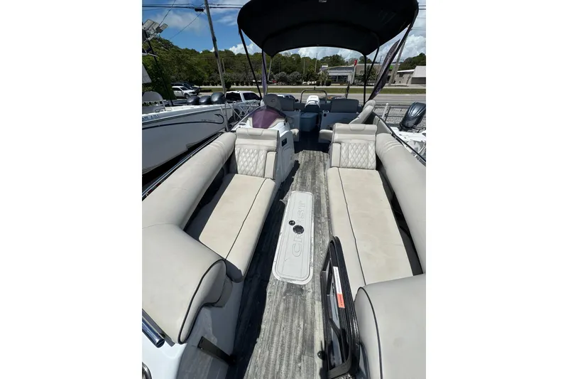 Slide: The Image of 2020 Crest Savannah 250 SLRC pontoon boat with spacious seating and canopy. - 5